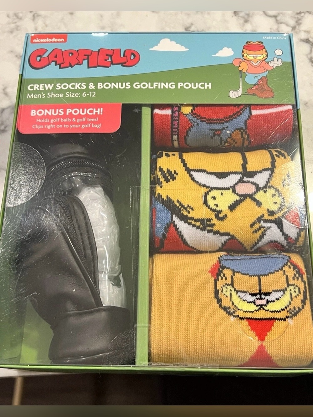 NIB Garfield 3
Pack crew socks with bonus golf bag pouch